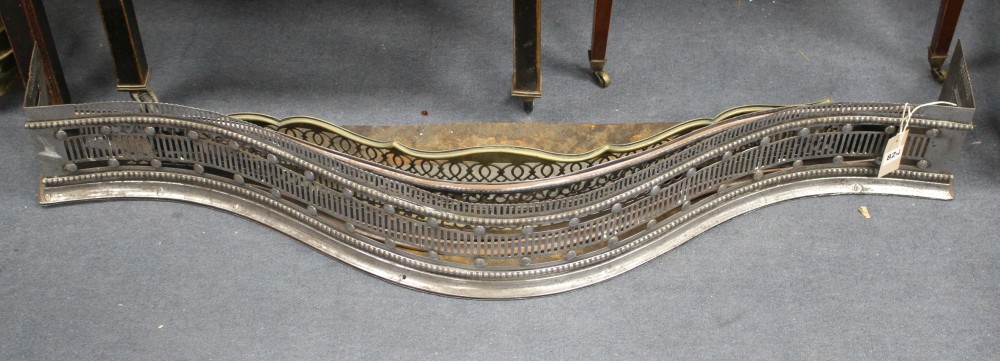 A George III cut steel fender, W.116cm, two other fenders and four assorted brass jardinieres